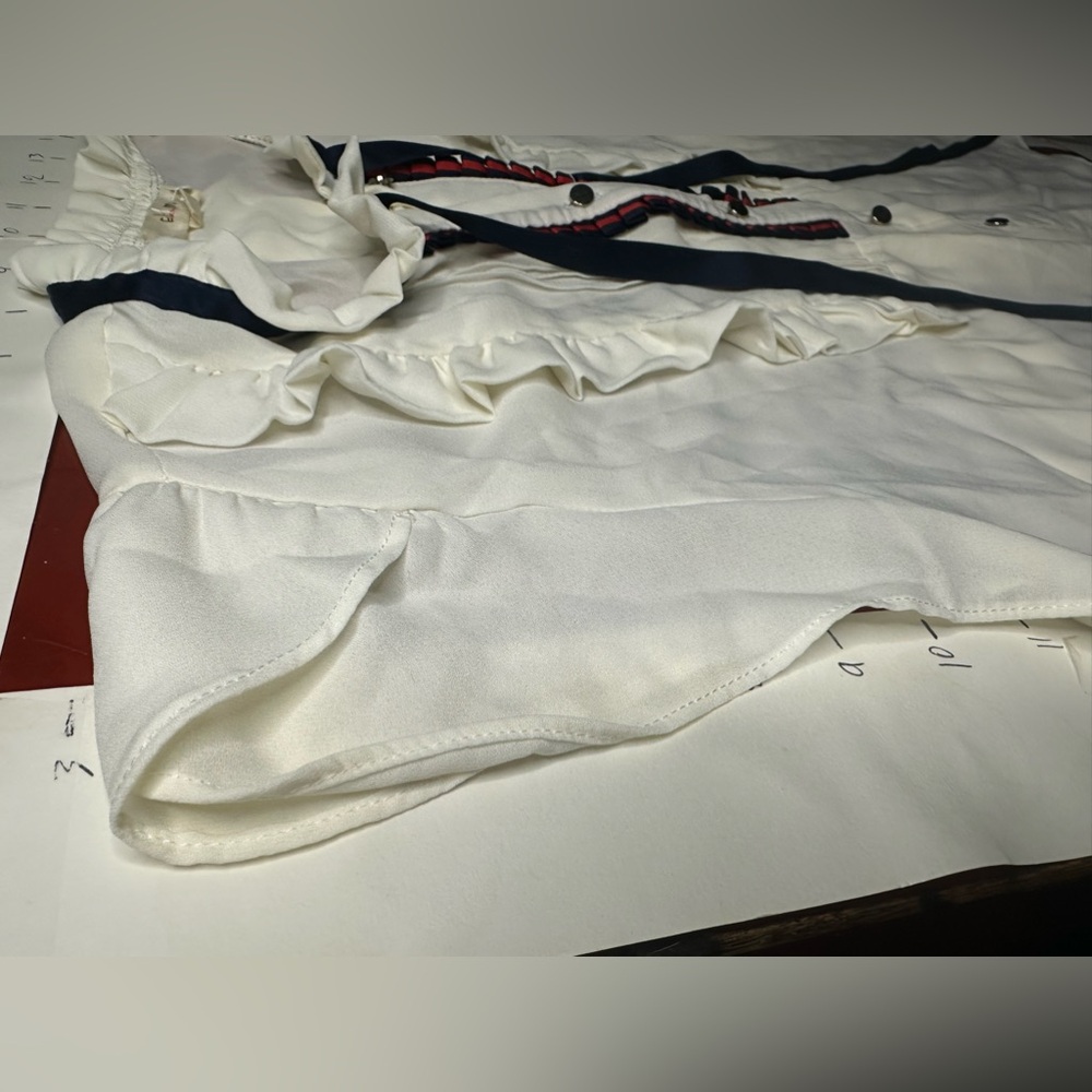 Cream Ruffled Blouse with Navy and Red Accents